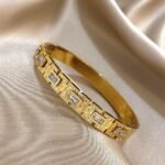 Regal Emerald Crystal Engraved Gold Bangle - Image 2